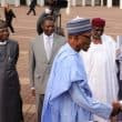 Muhammadu Buhari and other government officials welcoming visiting President Emmanuel Macron