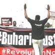 Protesters Carry placard and banners during a June 12 democracy day rally in Abuja. Photo: Afolabi Sotunde/Reuter.