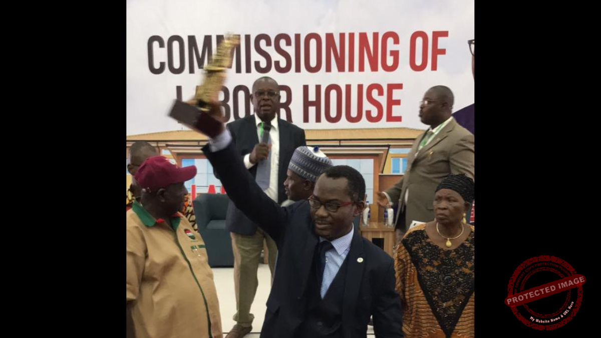 Enabulele flaunting his award