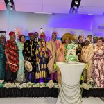 Evangelist Alao with elders of the Nigerian community cutting the anniversary caje