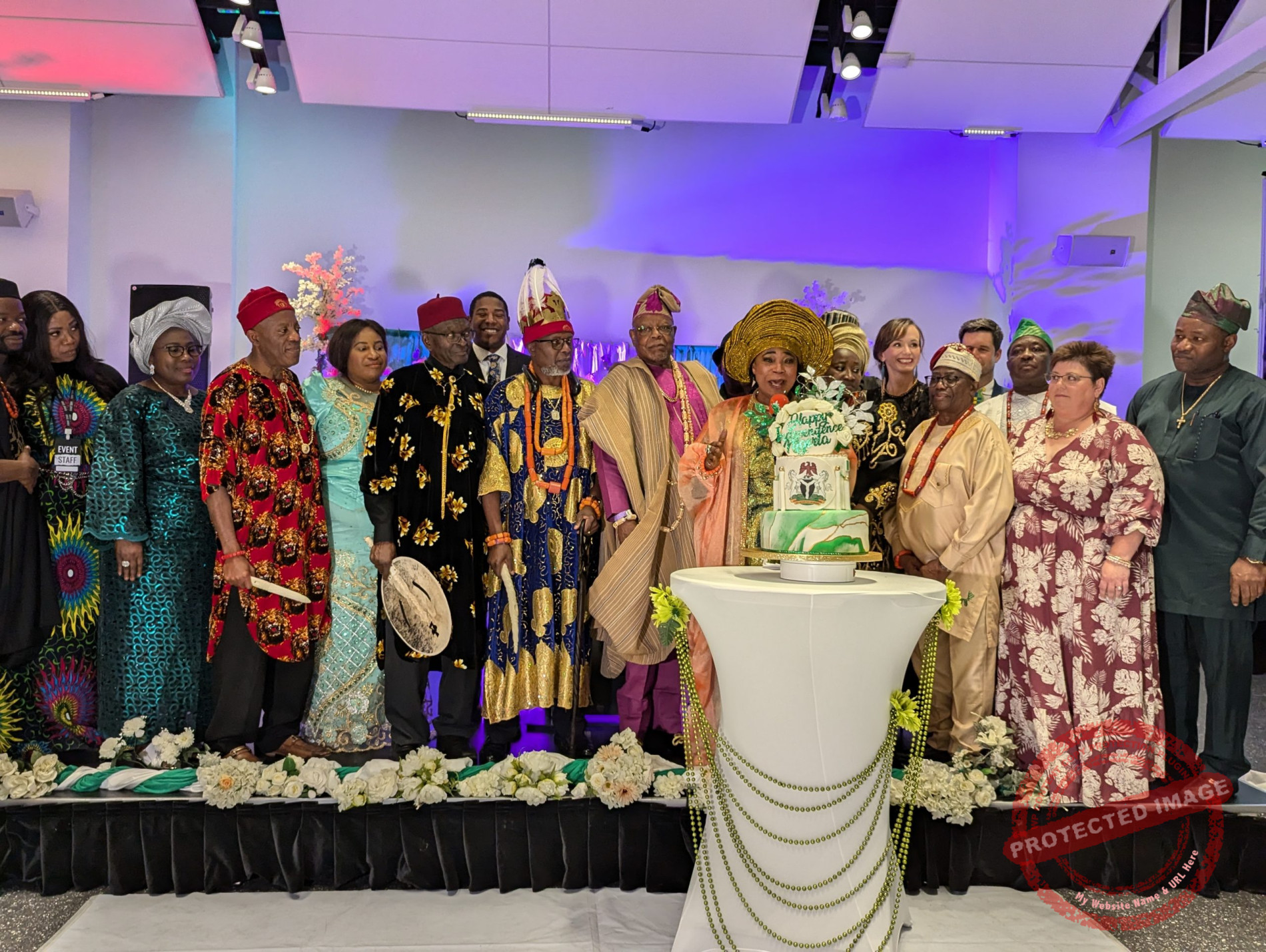Evangelist Alao with elders of the Nigerian community cutting the anniversary caje
